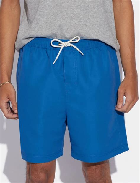 From Beach to Boardroom: Coach Magic Print Shorts